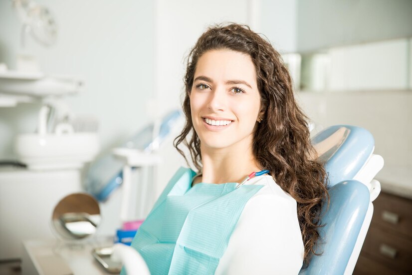 portrait smiling young woman sitting chair dental clinic 662251 2583